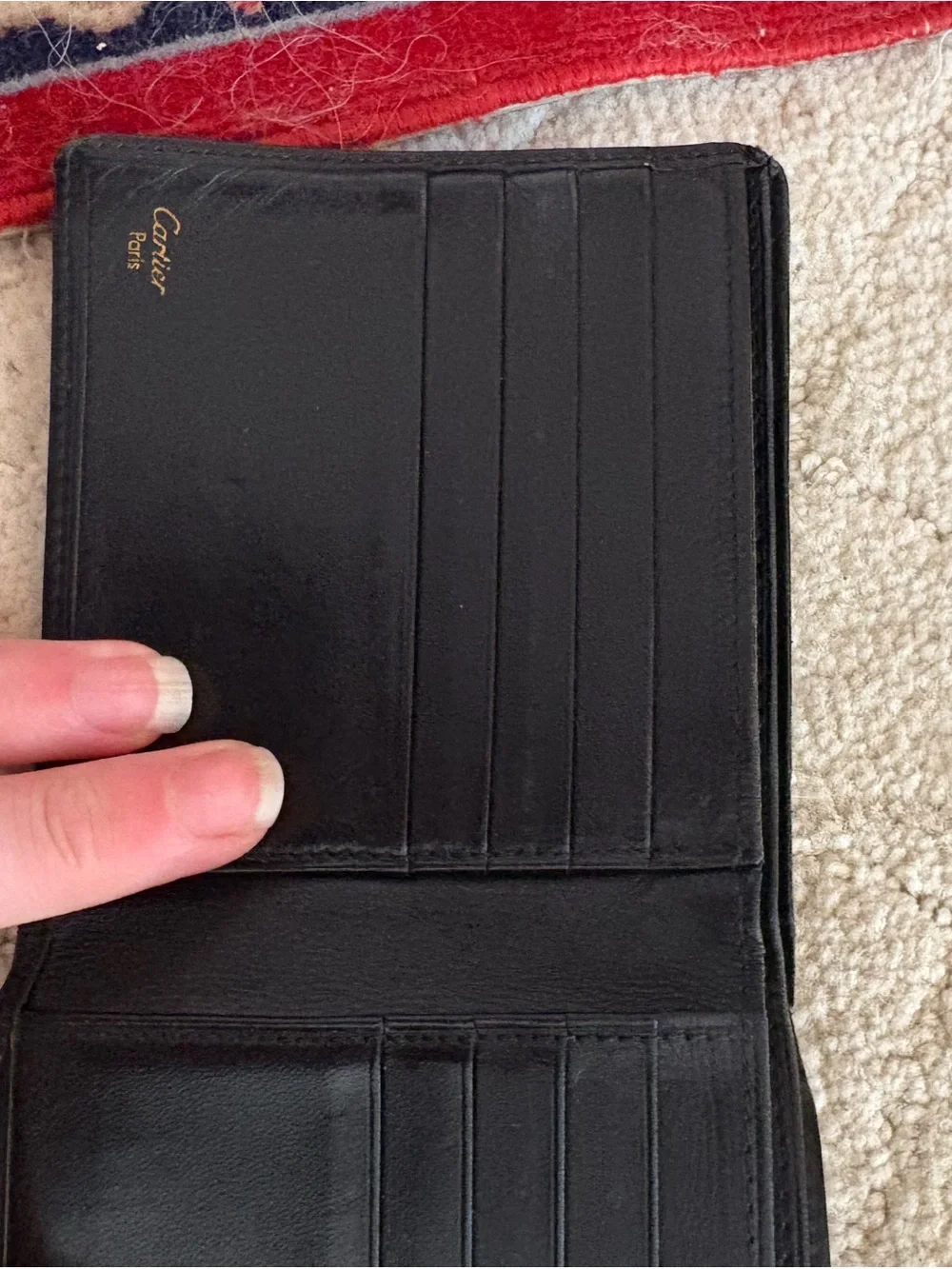 Cartier Black Leather Bi-Fold Card Holder with Gold Emblem